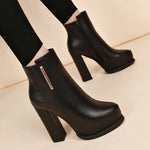 Black ankle-high heeled boots