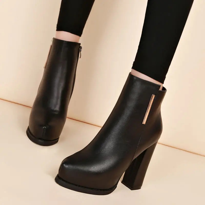 Black ankle-high heeled boots