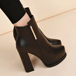 Black ankle-high heeled boots